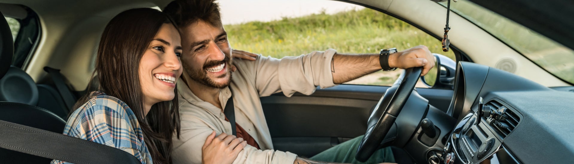 First Time Buyers driving off in their new vehicle